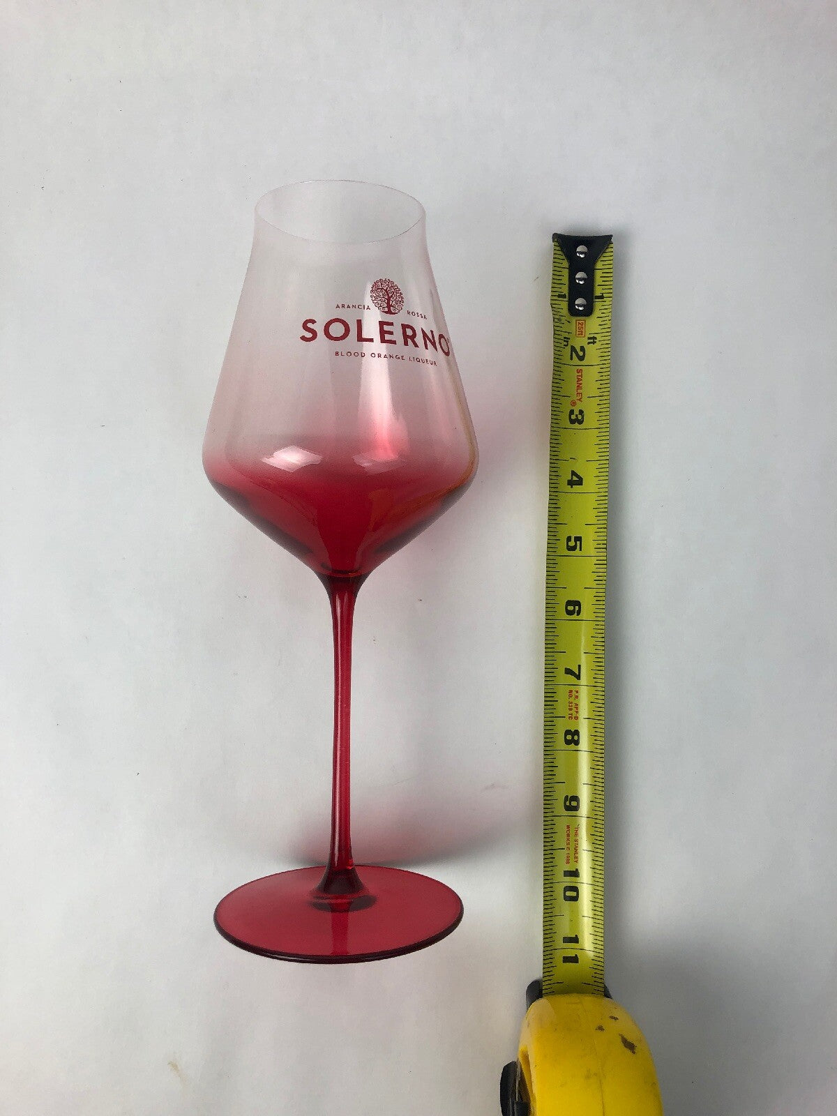 Set of two rare Solerno Blood Orange Liqueur long stem wine glasses.