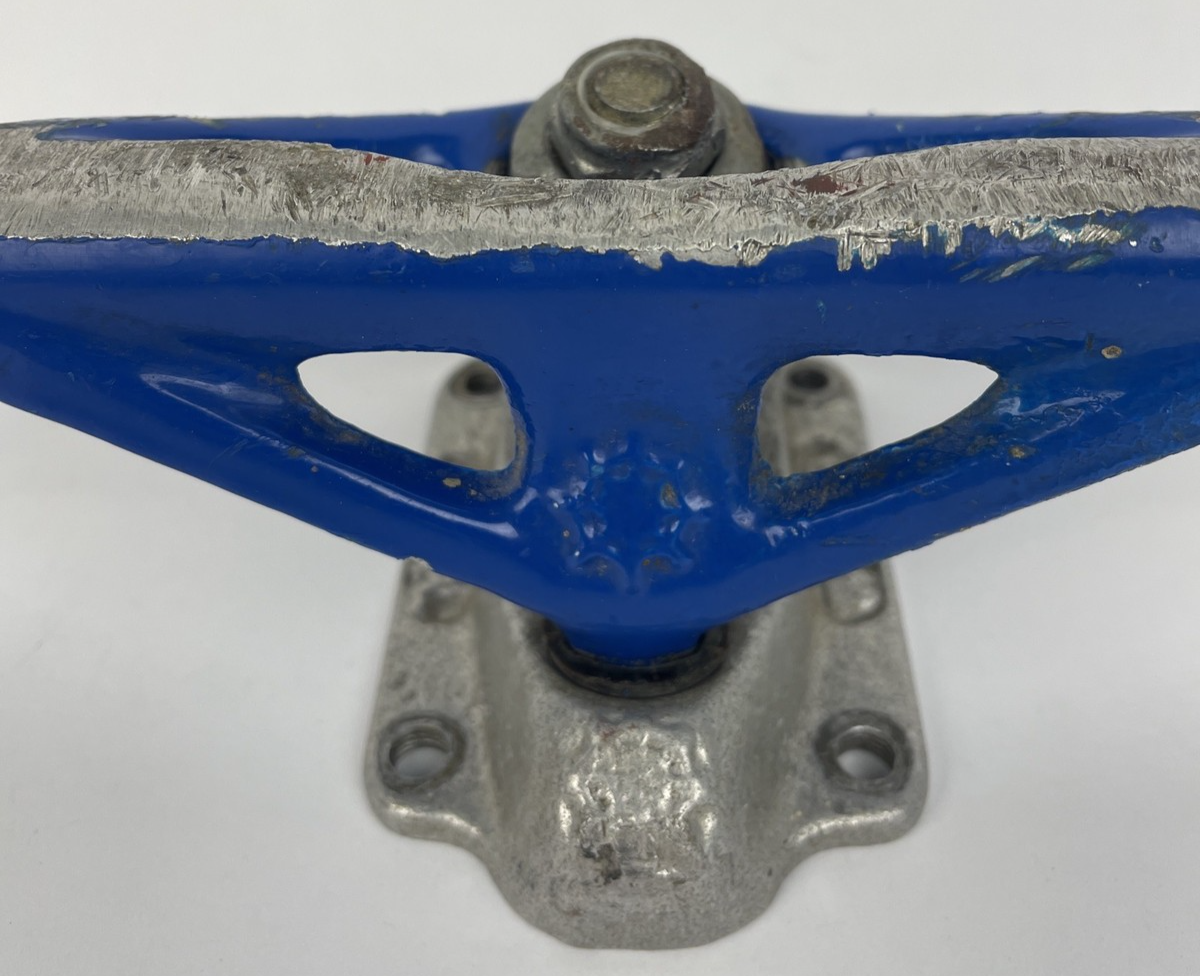 Vintage 1990s Webb Company USA blue single 8-inch skateboard truck.