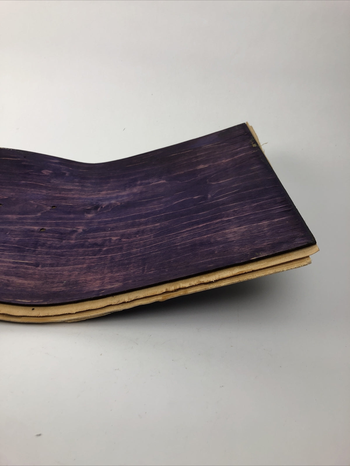 Blank uncut purple stain skateboard deck 10 x 34 inches with 14.25-inch pre-drilled wheelbase.