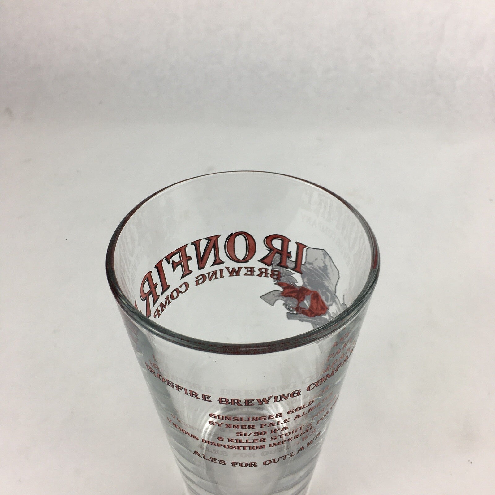 Iron Fire Brewing clear pint beer glass with brewery logo.