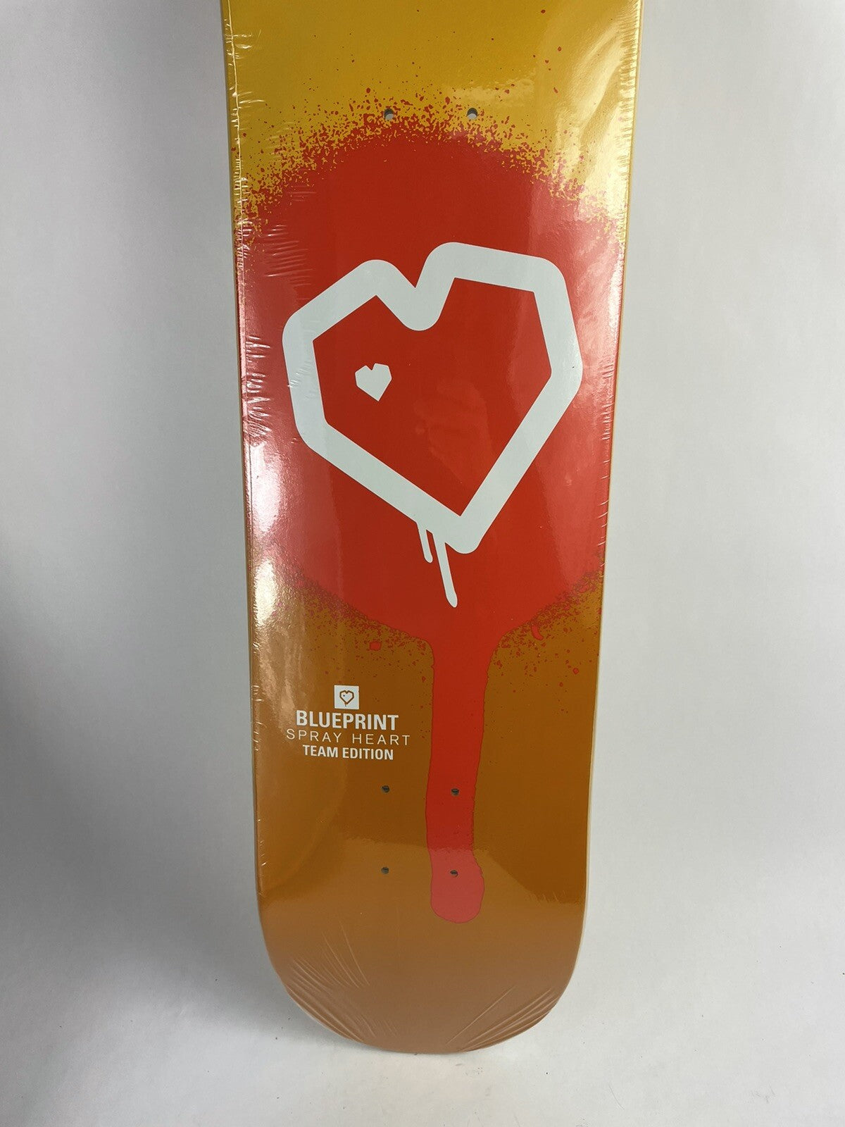 Blueprint Skateboards Spray Heart Muddy Orange 8-inch hard rock maple skateboard deck.