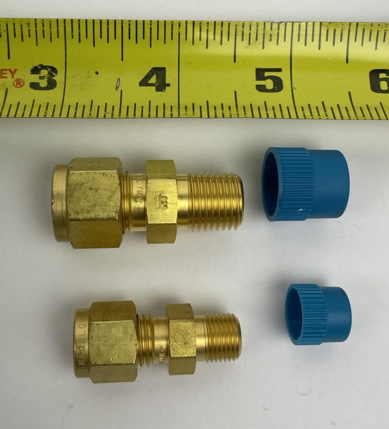Two Swagelok B-600-6 brass tube unions for 3/8 inch OD tubing industrial fluid fitting connectors