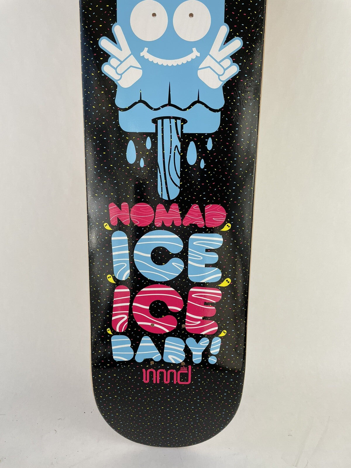 Nomad Skateboards Ice Ice Baby 8.25-inch hard rock maple skateboard deck with grip tape and premium graphic artwork.