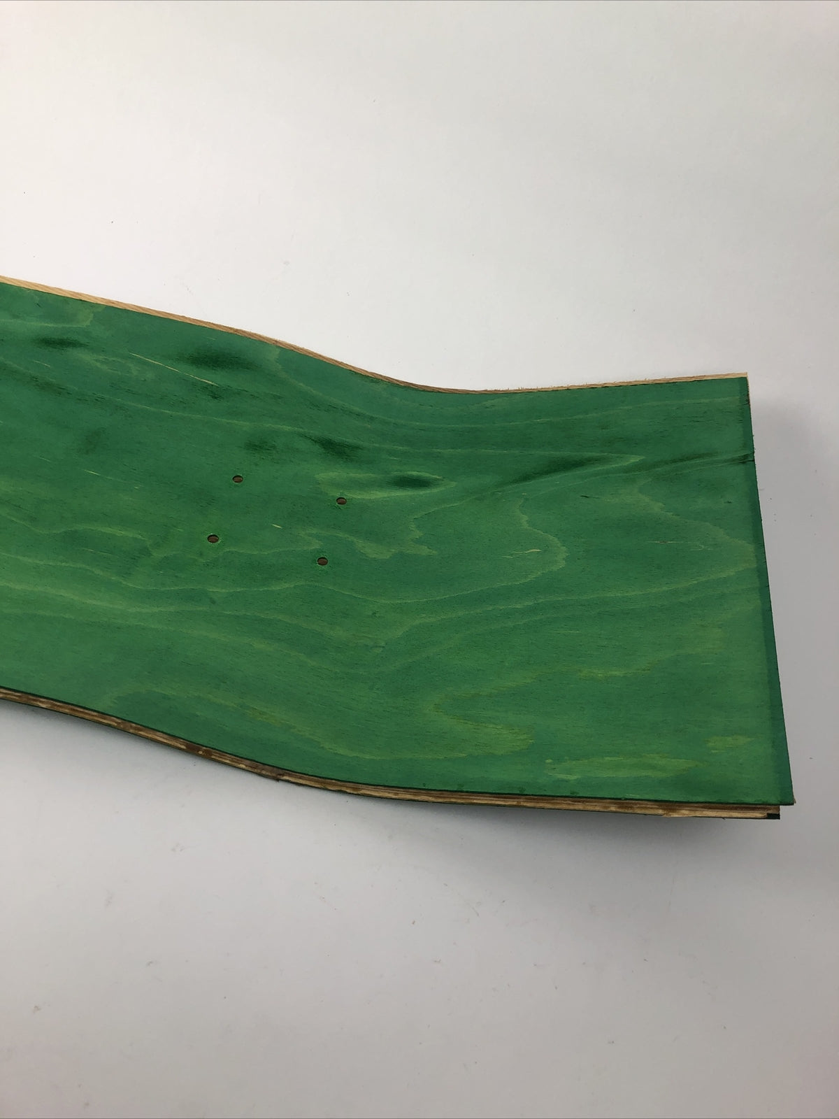 Blank uncut 10 x 34-inch green stain skateboard deck with 14.25-inch wheelbase.