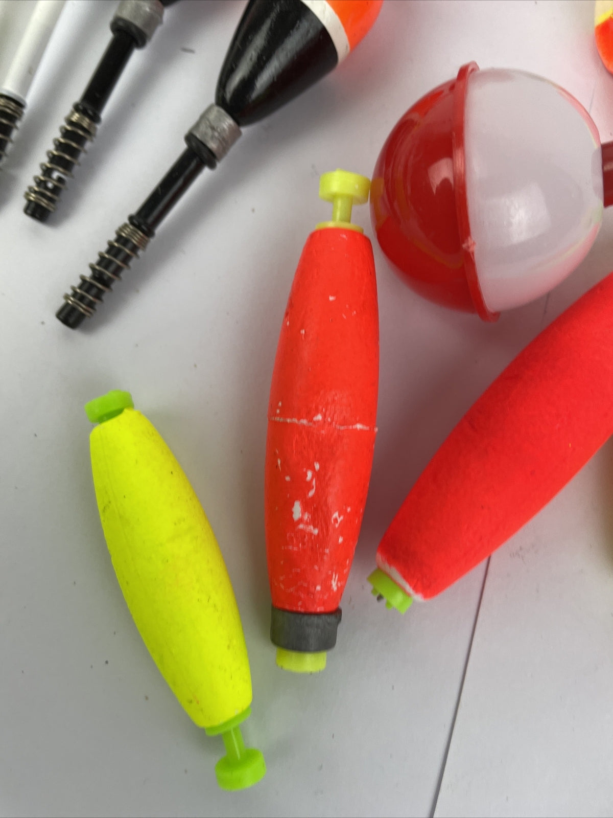 Lot of 16 round fishing bobbers in red white orange and yellow including Thill floats