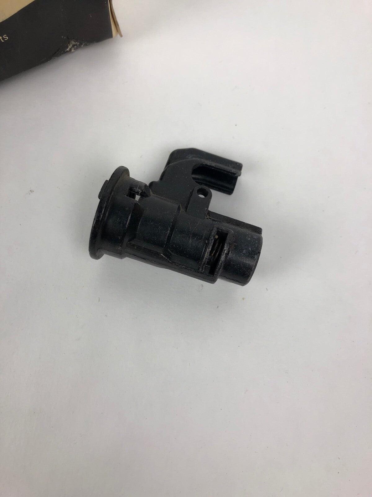 Genuine GM OEM 14044471 NOS glove box lock cylinder case and rotor for 1976–1991 Chevrolet, GMC, Oldsmobile, and Cadillac vehicles.