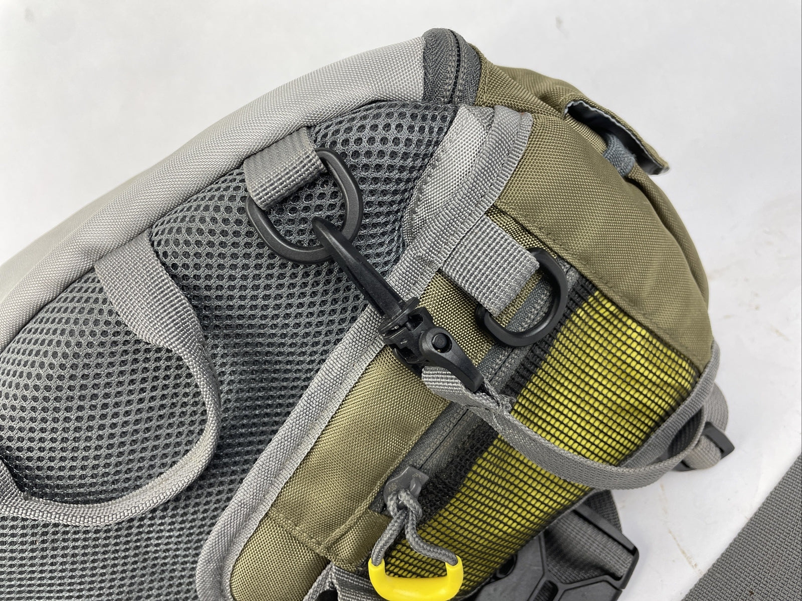 Cabela's Advanced Anglers green waist pack with extras for fly fishing and hiking.