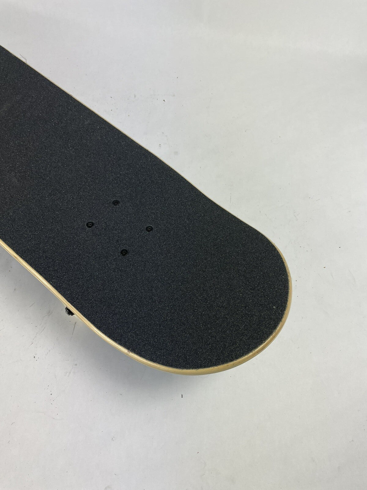 Blue blank 8-inch complete skateboard with gravity cast trucks, 52mm ATM wheels, and ABEC 7 bearings.