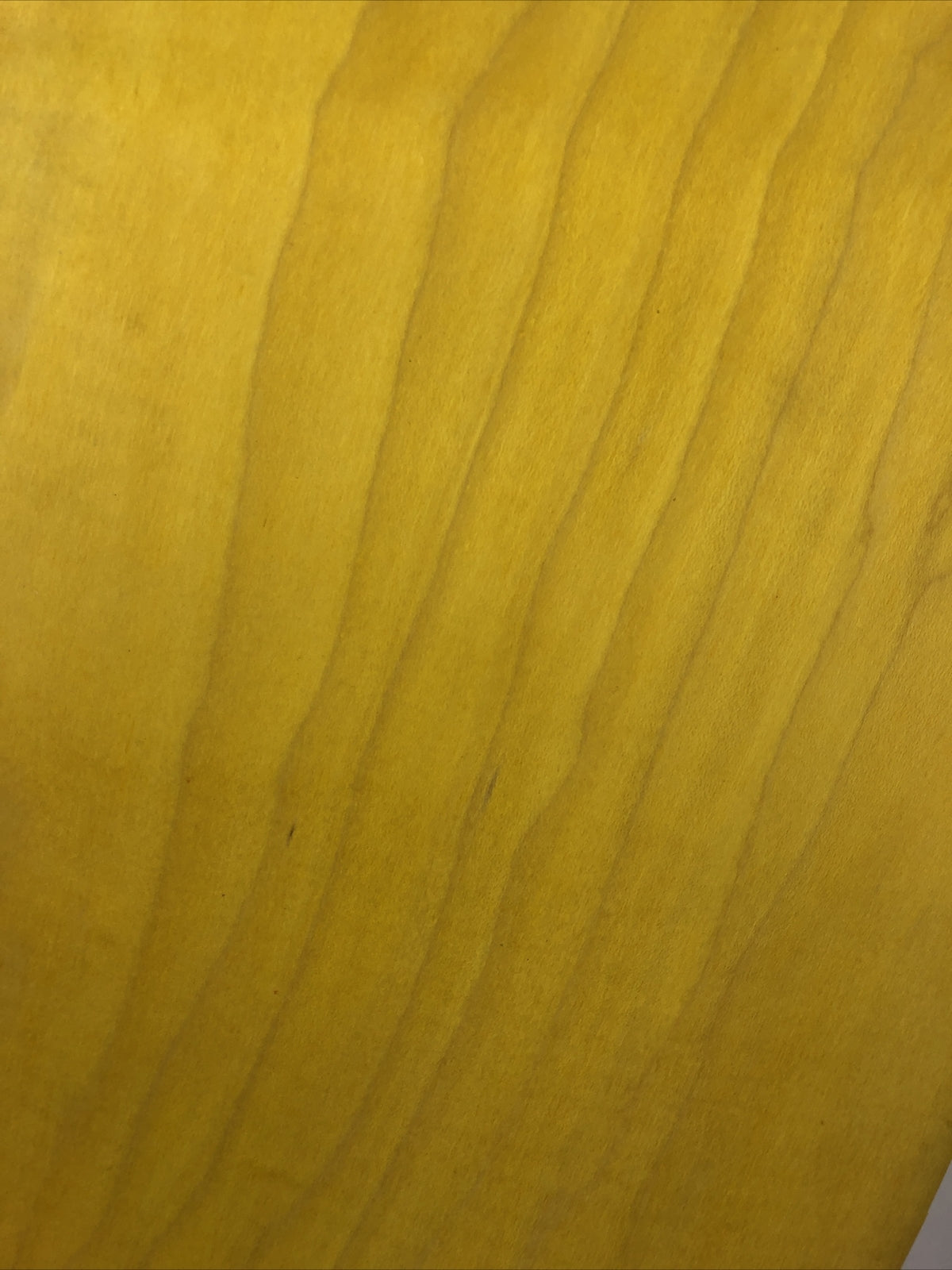 Blank uncut 10 x 34-inch yellow stain skateboard deck with 14.25-inch wheelbase.