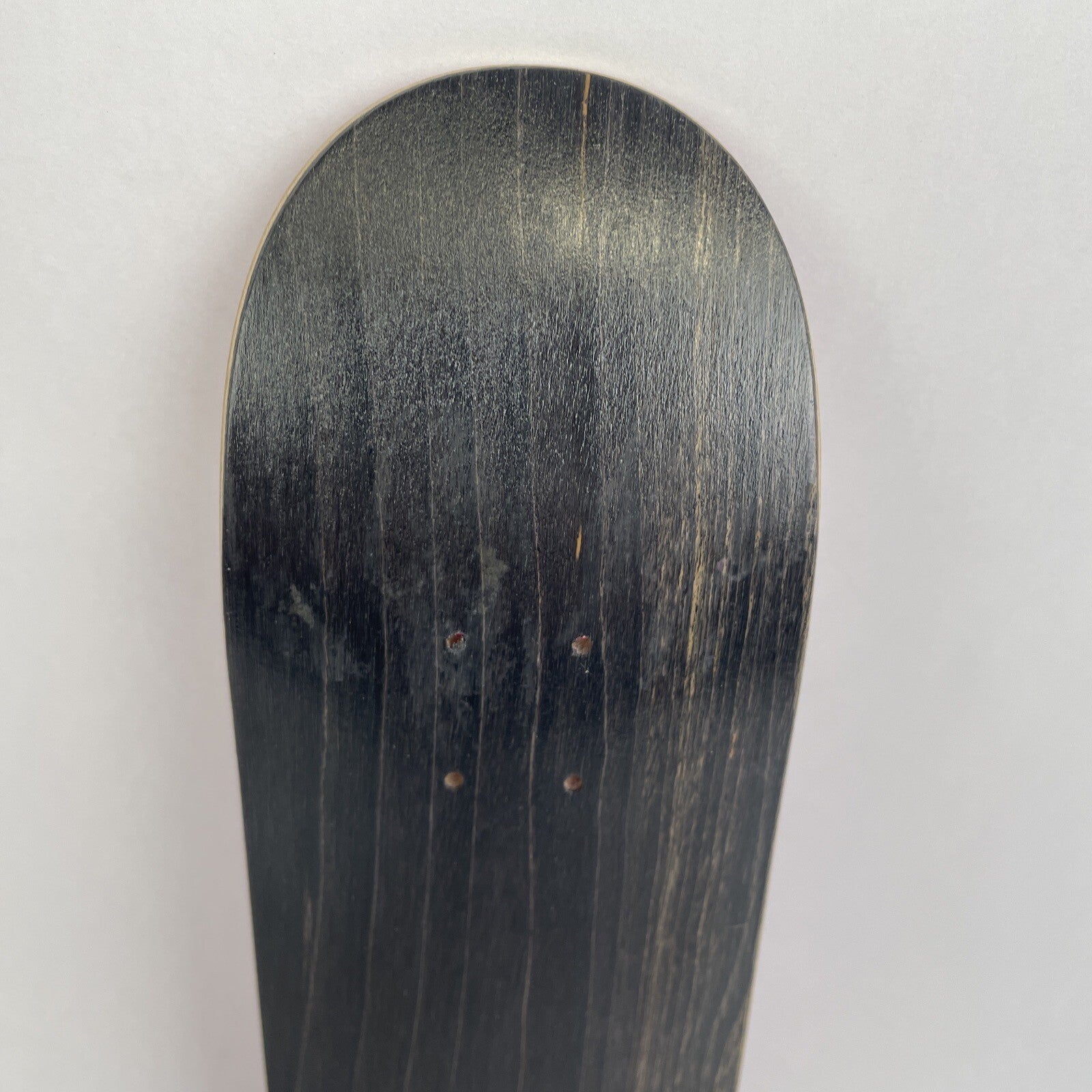 Blank Canadian maple miniature finger skateboard deck measuring 10.5 cm by 2.75 cm with 4.25 cm wheelbase.