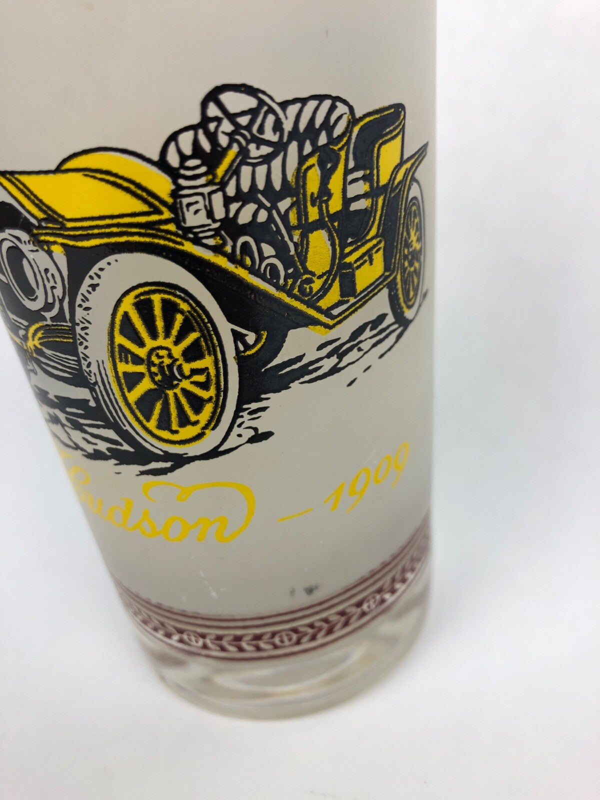 Vintage frosted cocktail glass featuring 1909 Hudson and 1914 Dodge with gold rim.