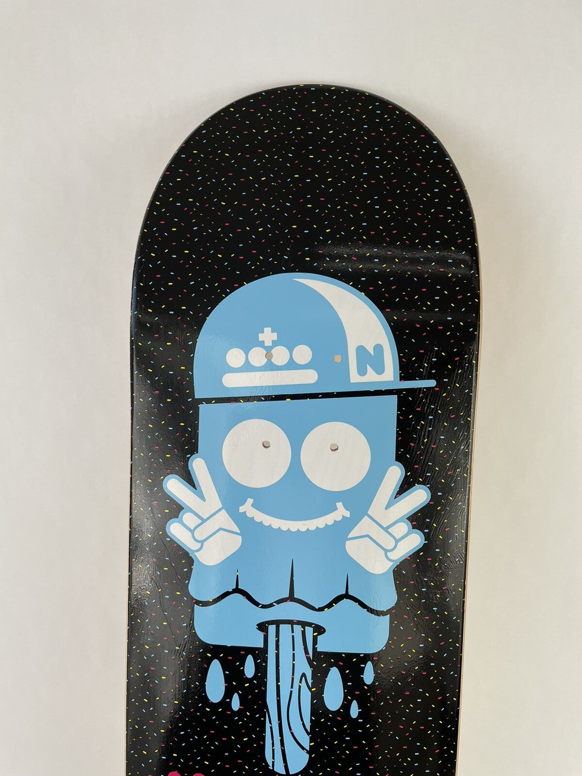 Nomad Skateboards Ice Ice Baby 8.25-inch hard rock maple skateboard deck with grip tape and premium graphic artwork.