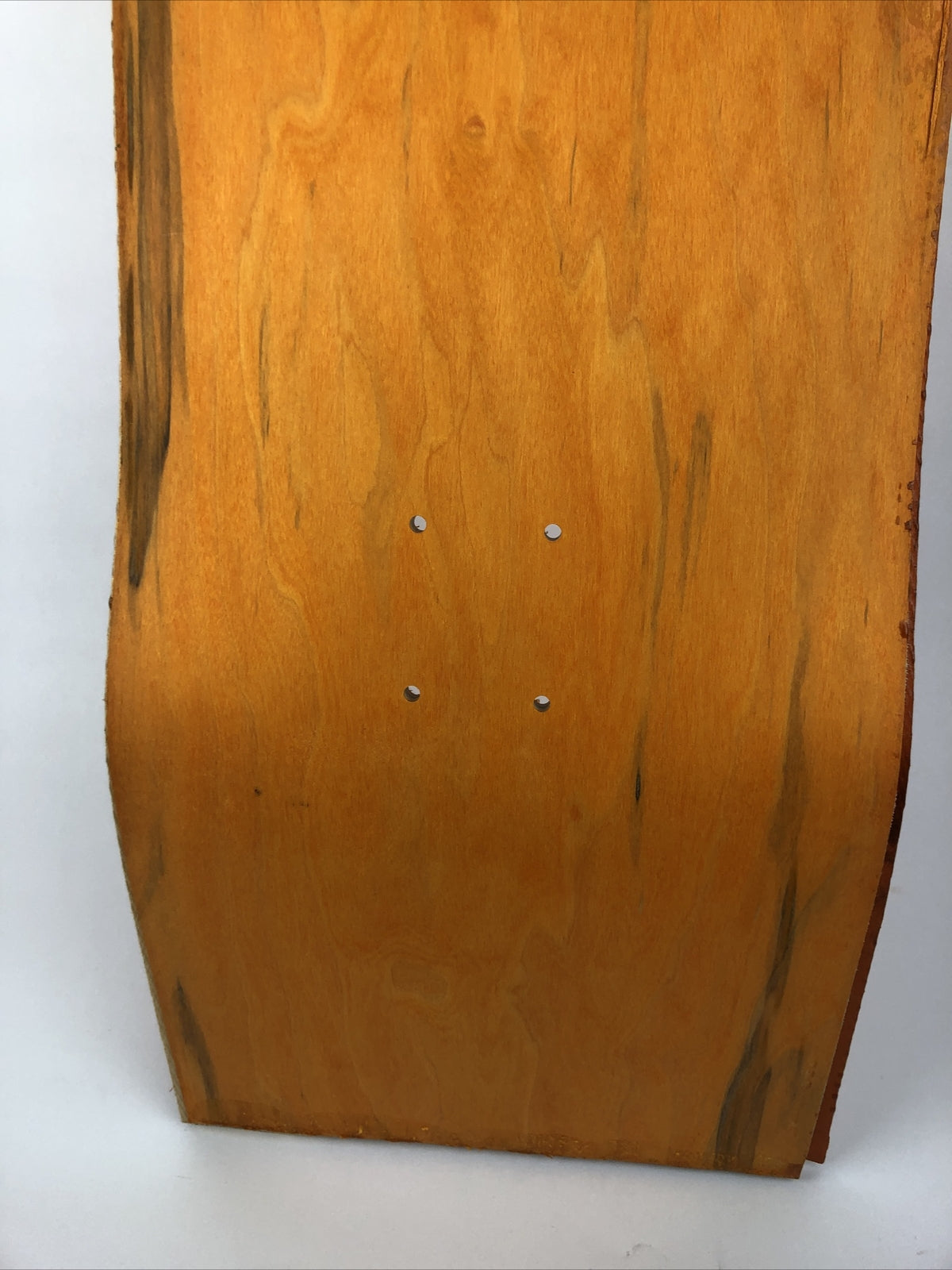 Blank uncut 10 x 34-inch orange stain skateboard deck with 14.25-inch wheelbase.