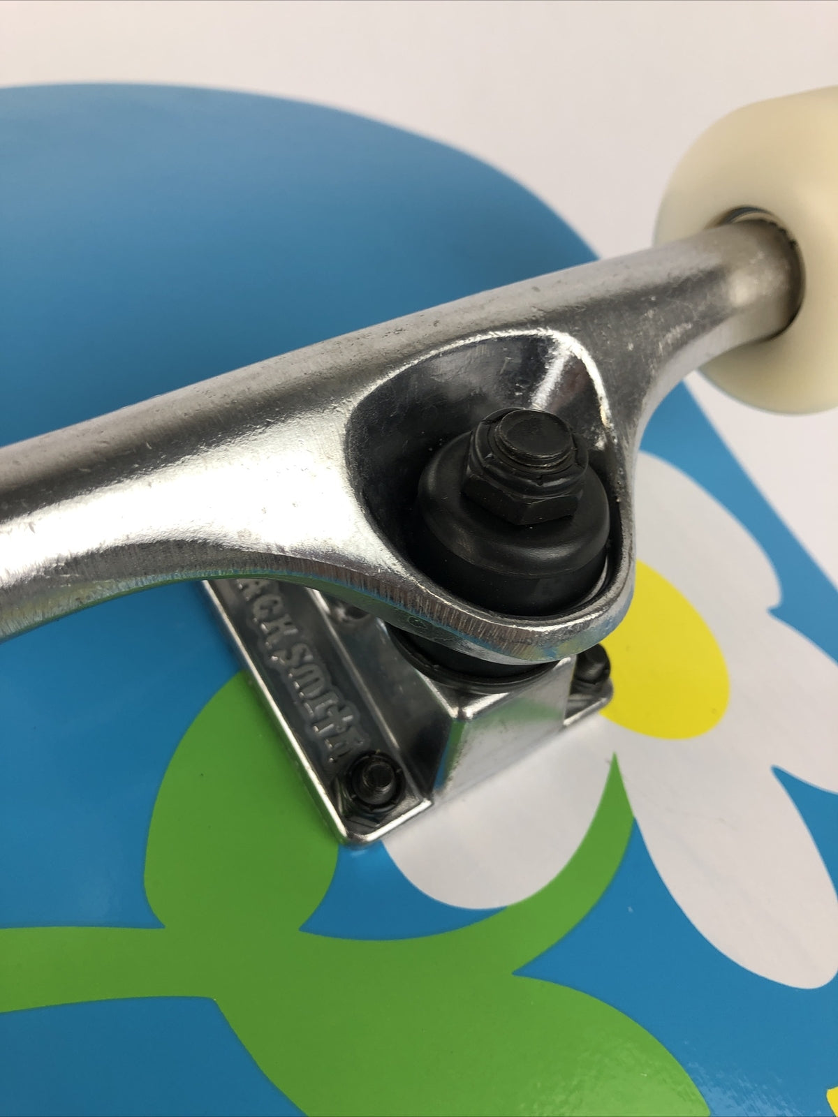 ATM Click Have a Nice Day 8-inch complete skateboard with Black Smith trucks and 52mm wheels.