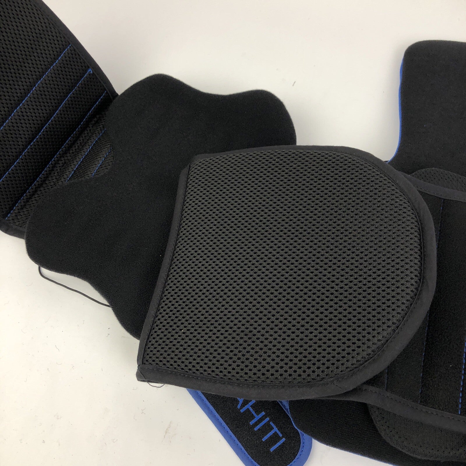 Black unisex lumbar support back brace with pulley adjustment system.