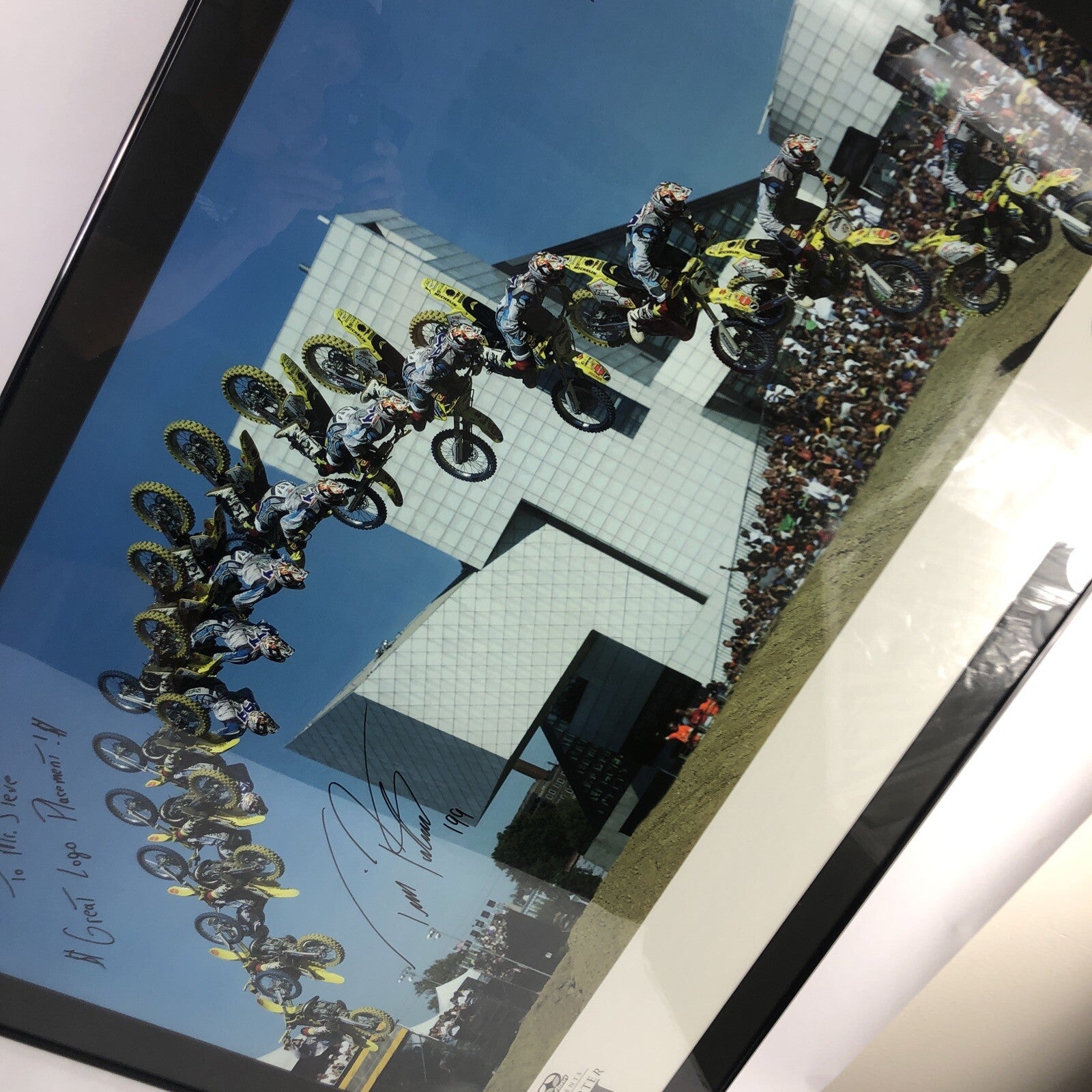 Travis Pastrana signed framed No Fear backflip poster measuring 42.5 by 30.5 inches.
