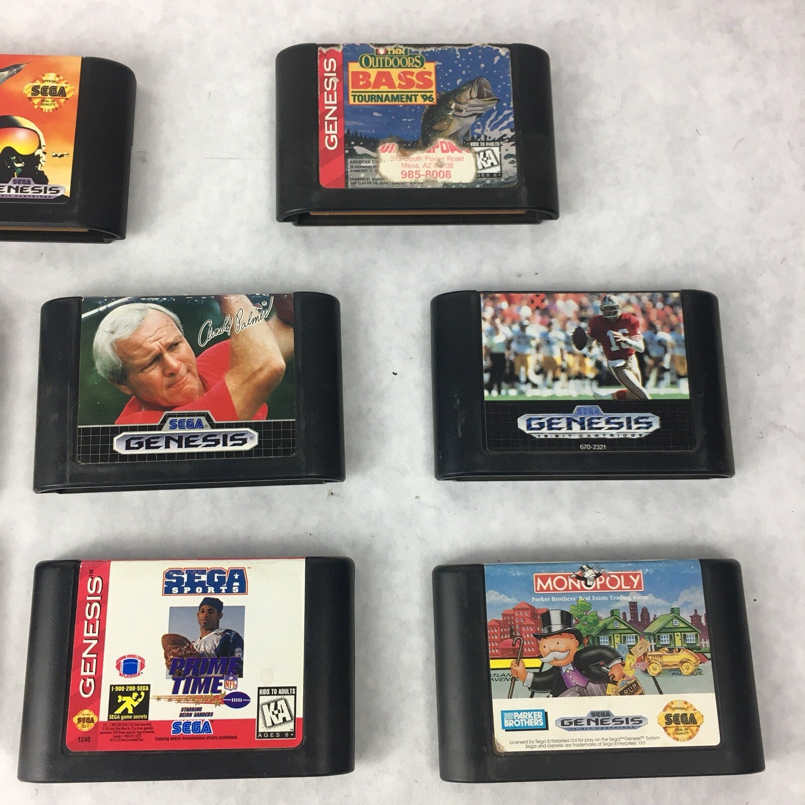 Lot of 8 authentic Sega Genesis games including Mortal Kombat Zoop MIG-29 Monopoly and Outdoor Bass