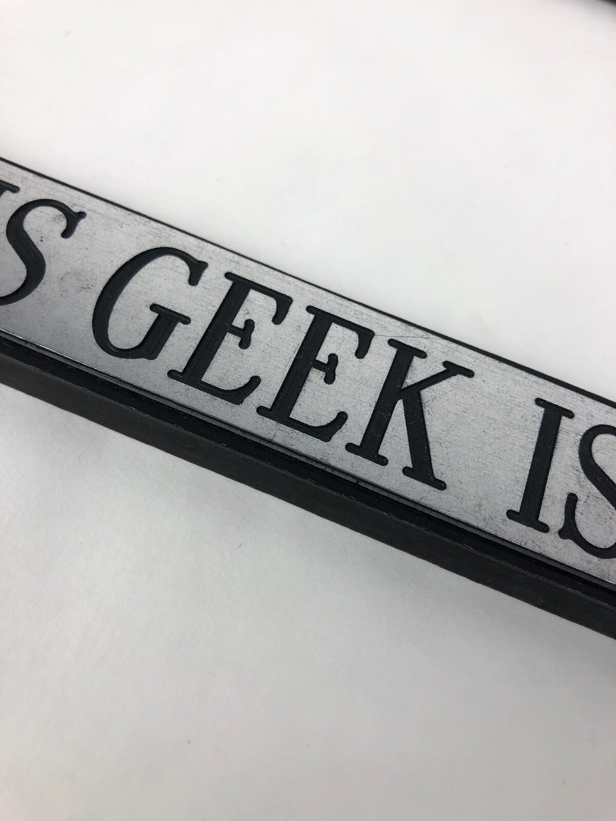 T.G.I.F. This Geek Is Female funny novelty license plate frame tailgate tag cover for standard vehicle license plates.