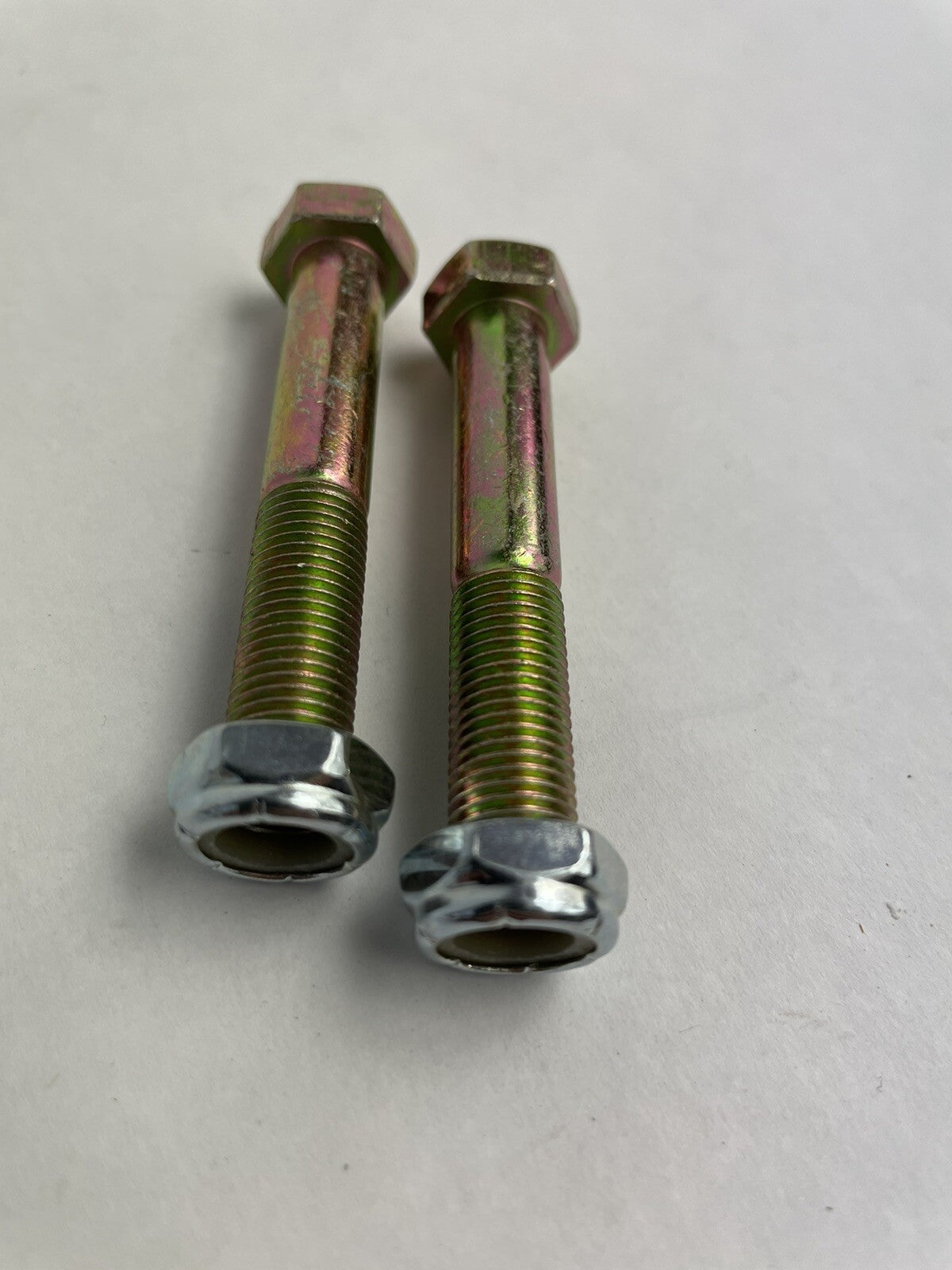 Grind King 2.5-inch skateboard and longboard kingpins with nylon locking nuts, set of two.