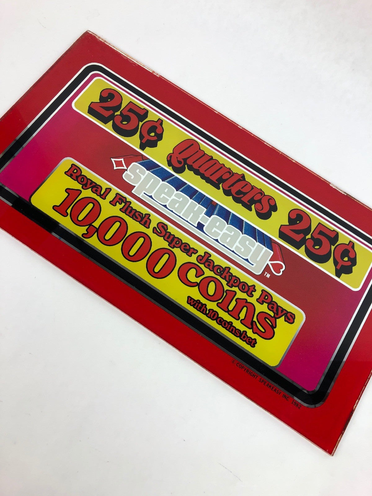 Vintage 1982 Speakeasy casino slot machine payout printed glass panel.