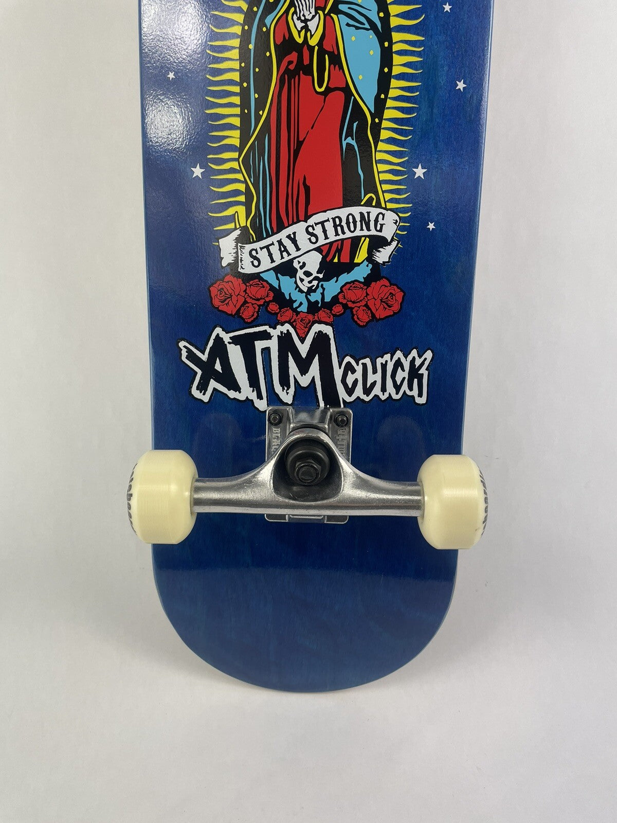 ATM Click Stay Strong 8-inch complete skateboard with Black Smith trucks and 52mm wheels.