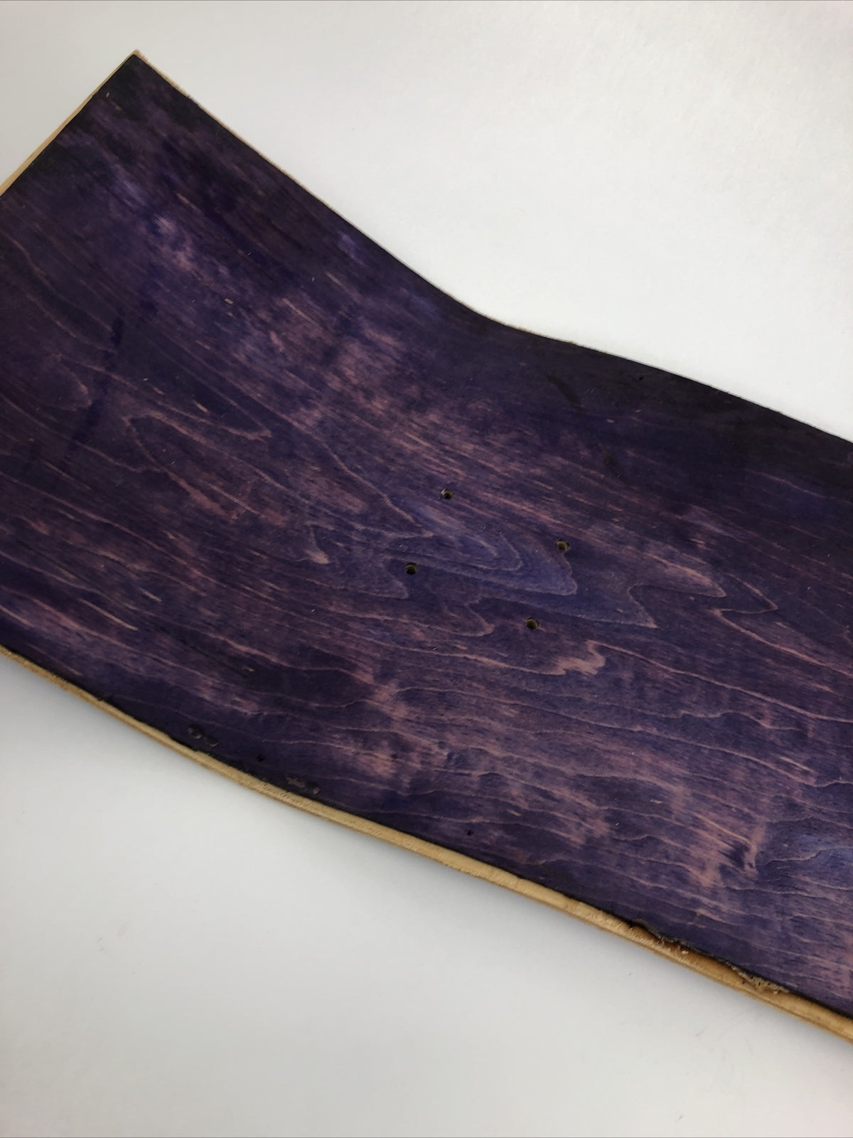 Blank uncut purple stain skateboard deck 10 x 34 inches with 14.25-inch pre-drilled wheelbase.