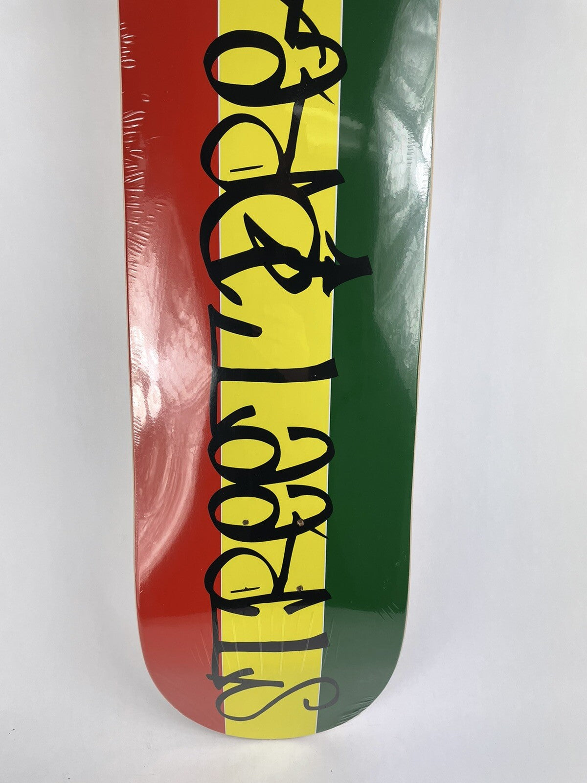Rasta Street Dreams 8.5-inch hard rock maple skateboard deck with colorful Rasta graphic.