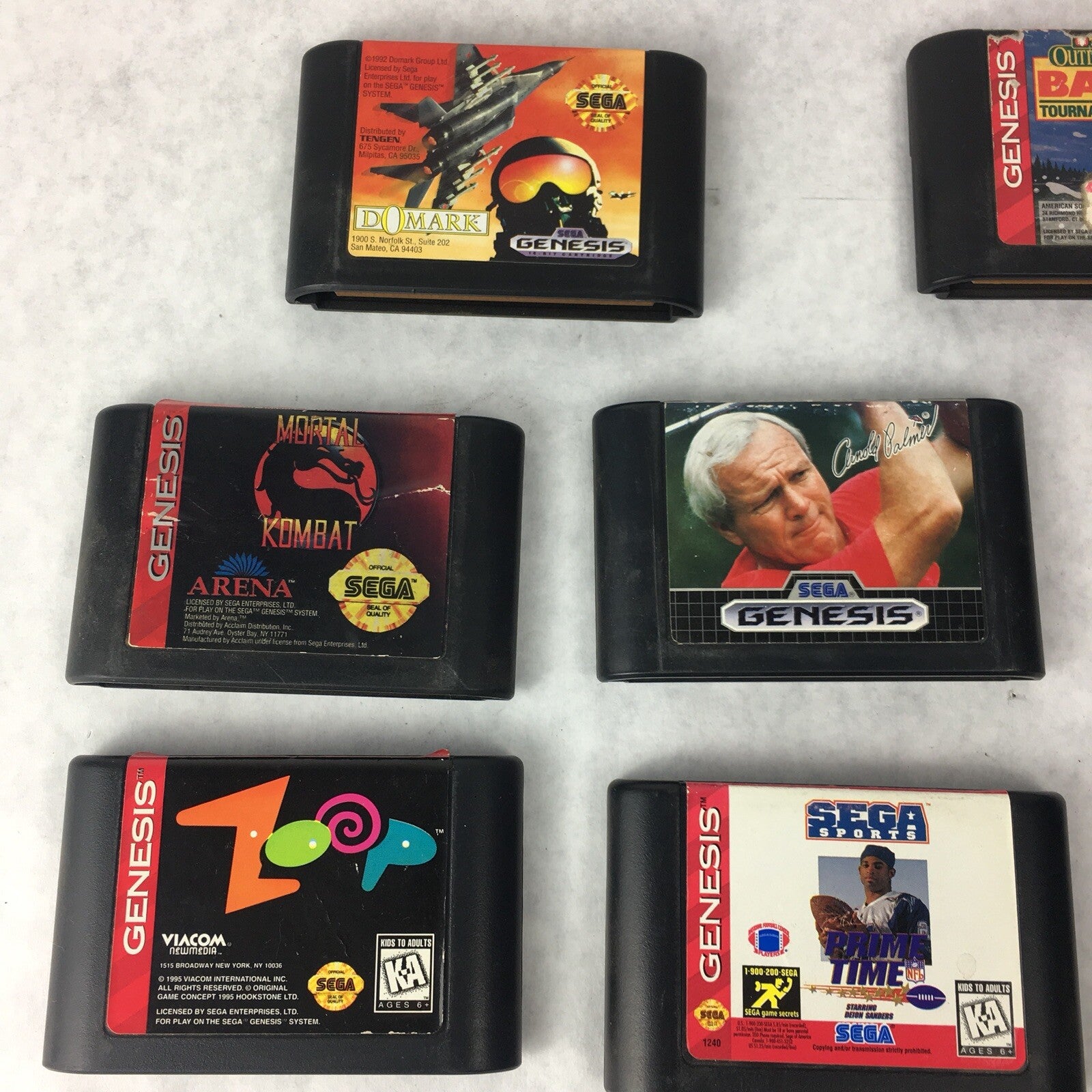 Lot of 8 authentic Sega Genesis games including Mortal Kombat Zoop MIG-29 Monopoly and Outdoor Bass