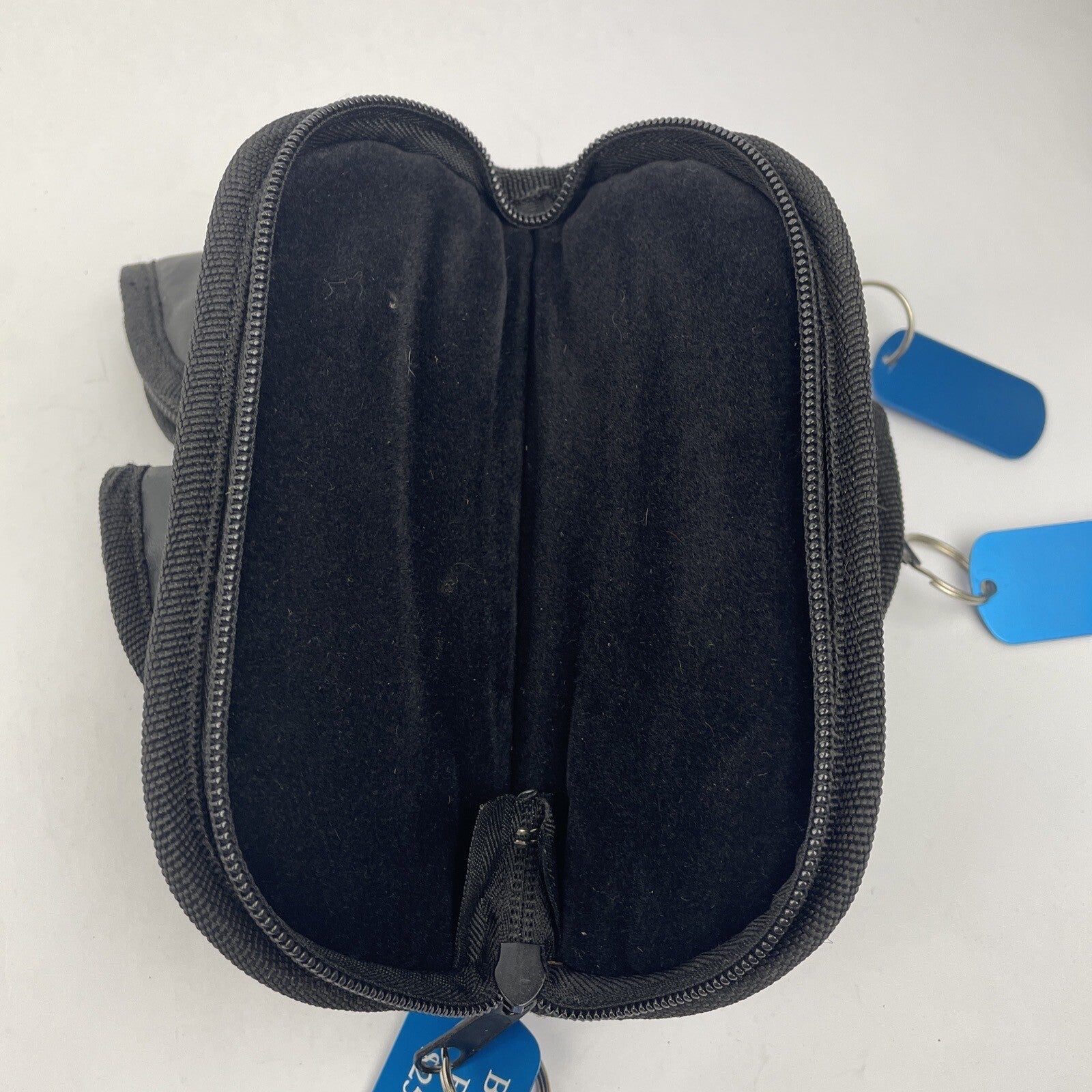 Lot of three black padded zippered storage pouches measuring 7 by 3 inches