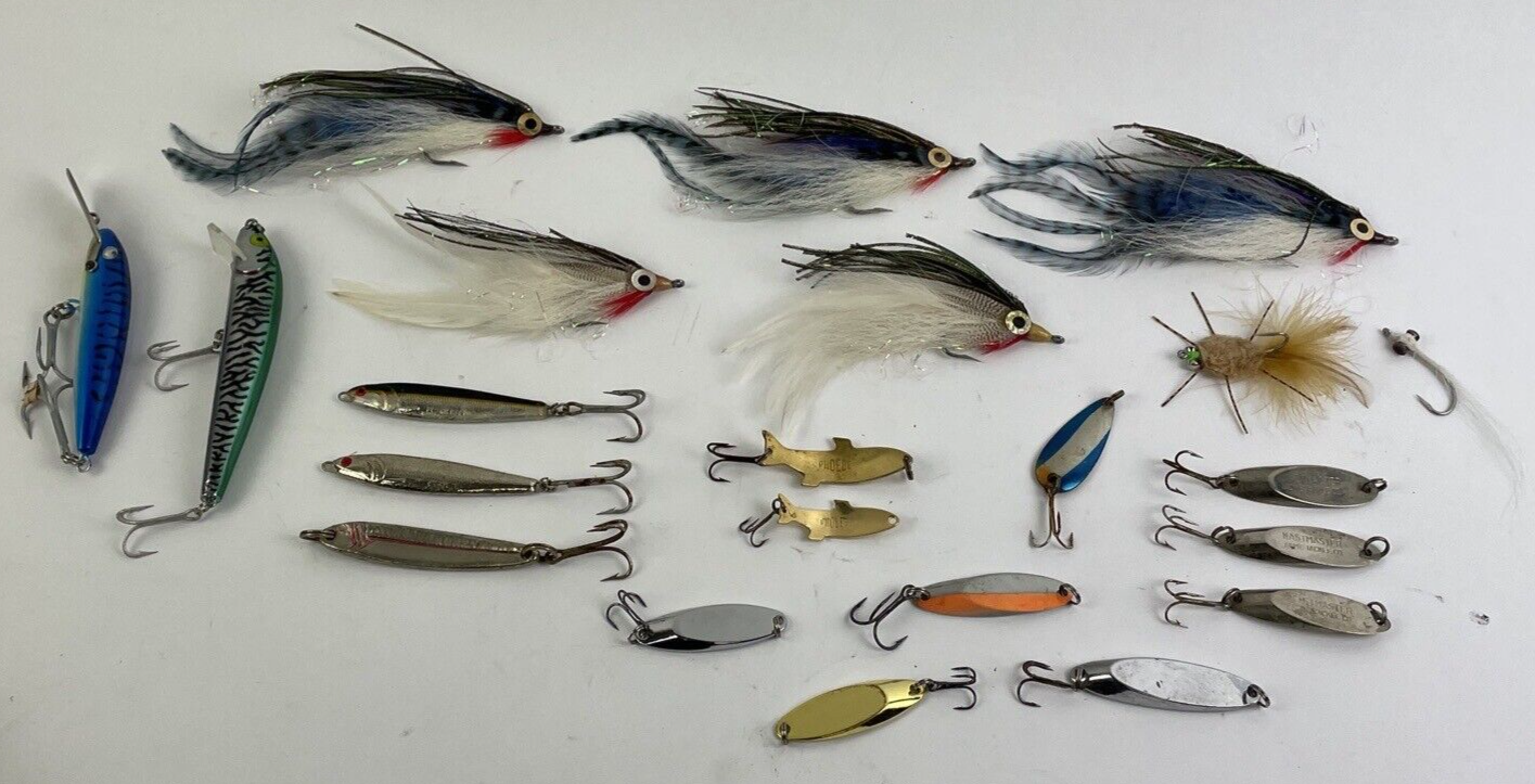 Lot of 22 assorted fishing spoons and spinners including Castmaster, Acme, and Phoebe lures.