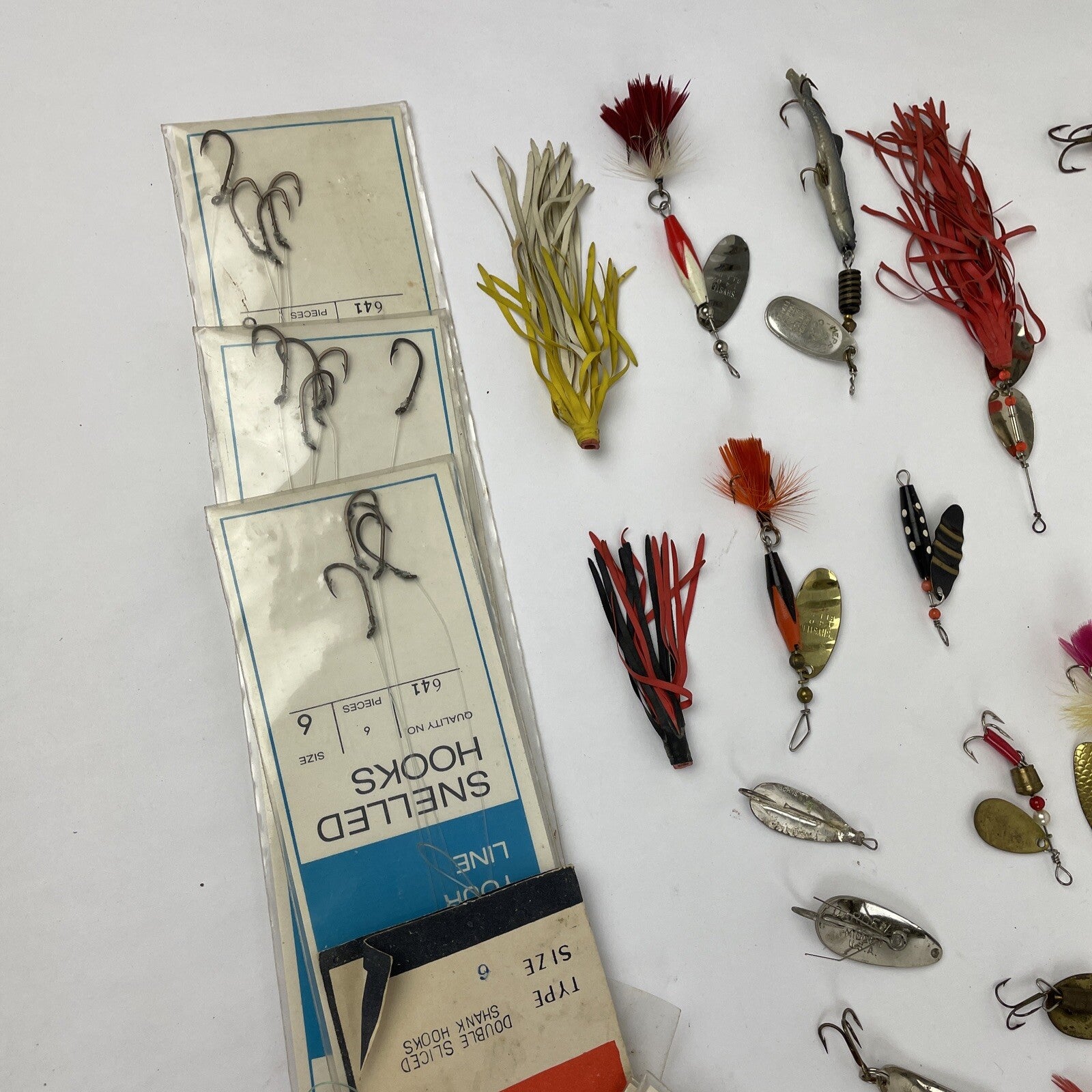 Vintage fishing lure lot with Jitterbug Rebel Floater Mepps and Shyster lures for trout crappie and bass fishing