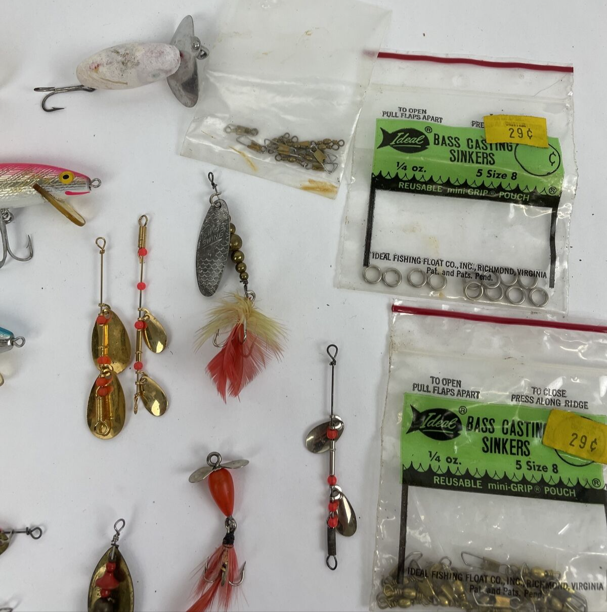 Vintage fishing lure lot with Jitterbug Rebel Floater Mepps and Shyster lures for trout crappie and bass fishing
