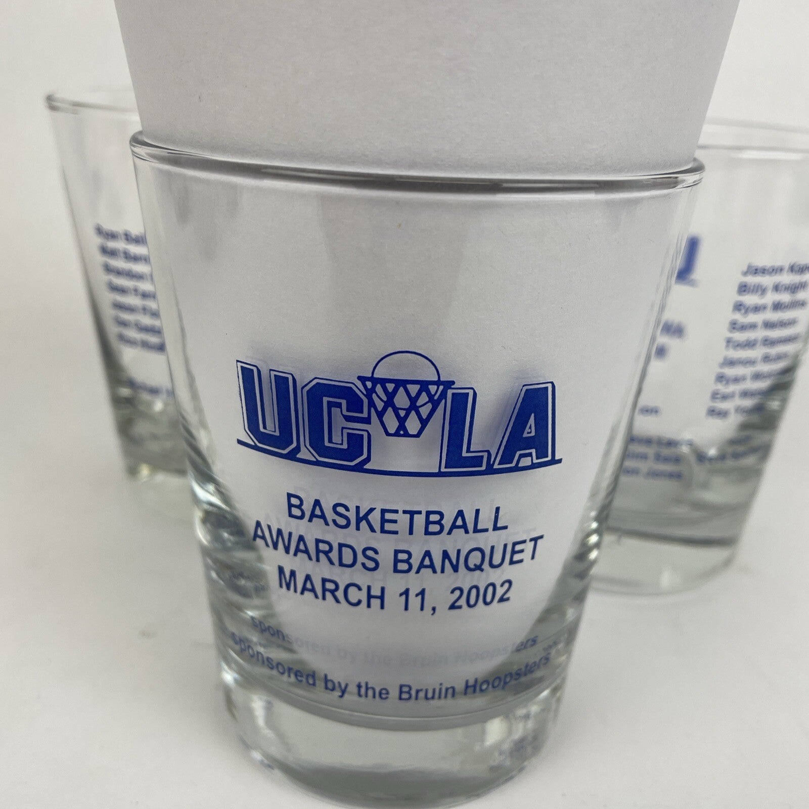 Set of three UCLA Bruins Basketball Awards Banquet highball glasses from 2000, 2001, and 2002.