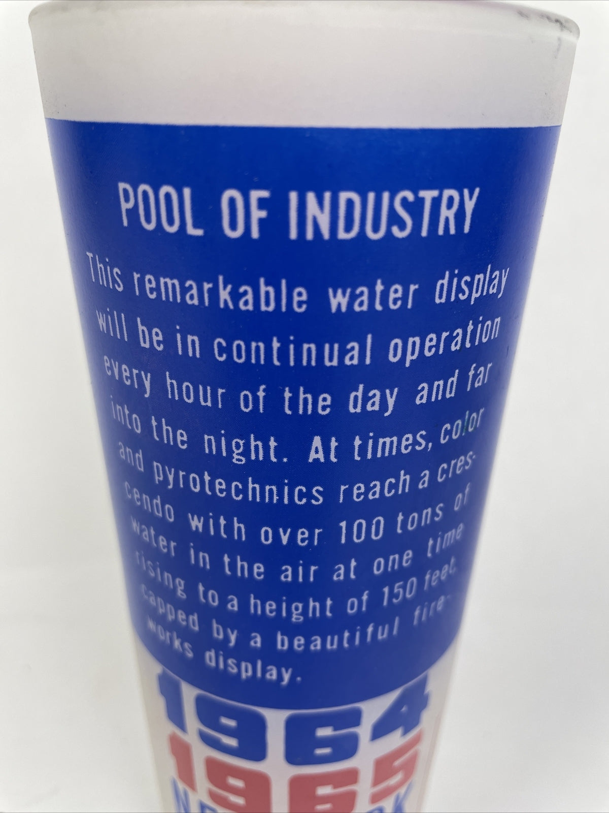 Vintage 1964–1965 New York World's Fair Pool of Industry souvenir glass with red white and blue graphics.