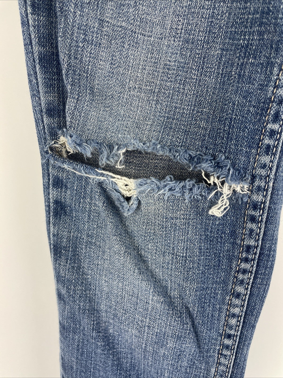 Levis 524 Too Superlow Jeans Women's Size 0M Light Wash Stretch - Worn Tattered