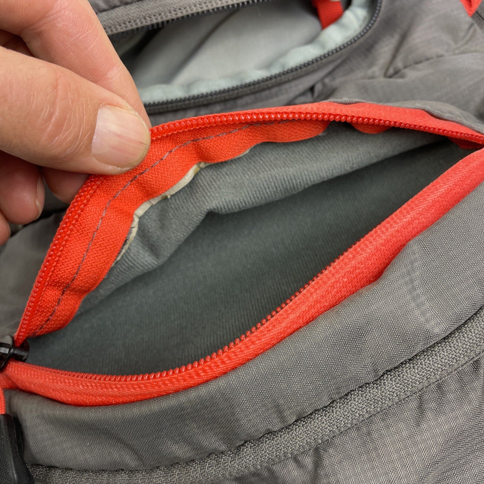High Sierra Visalia gray hydration backpack with adjustable straps and mesh back panel.