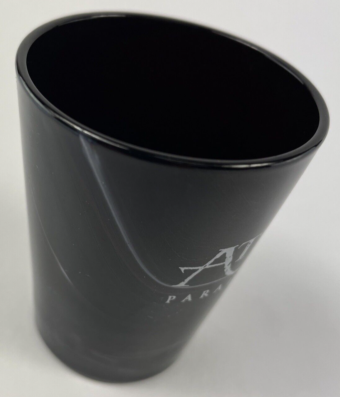 Atlantis Paradise Island black swirl glass souvenir shot glass.