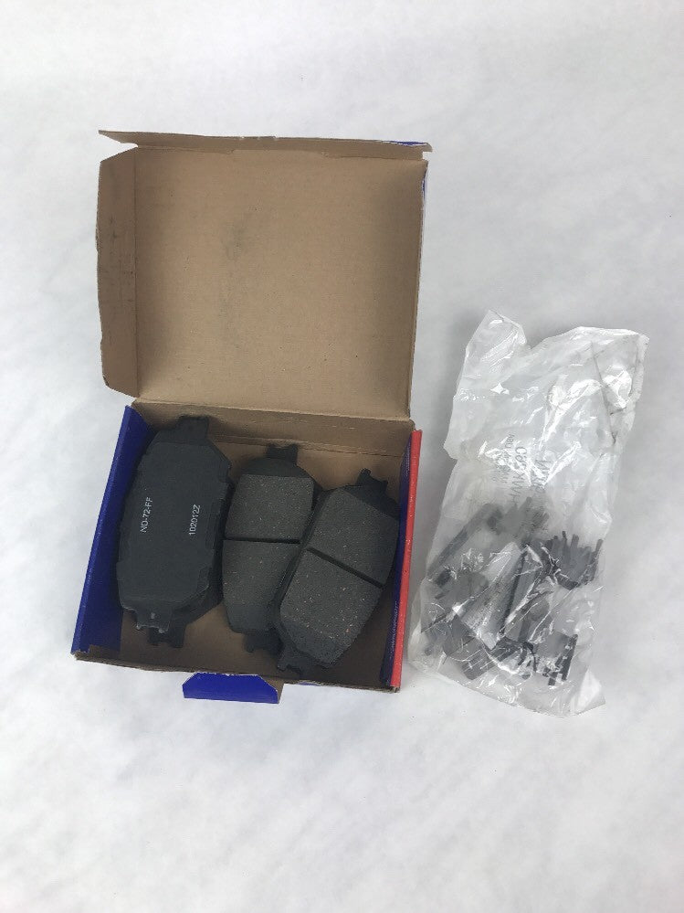 NAPA SS7787X front ceramic disc brake pad set OEM replacement brake pads with anti-squeal shims for automotive front disc brake systems.
