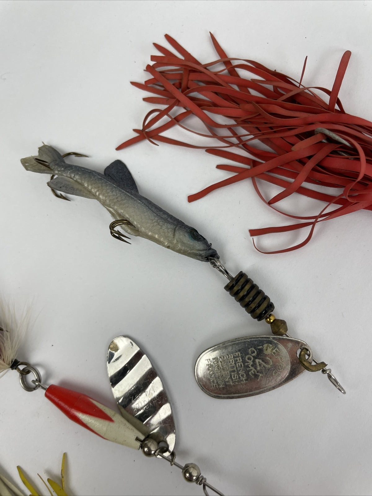 Vintage fishing lure lot with Jitterbug Rebel Floater Mepps and Shyster lures for trout crappie and bass fishing
