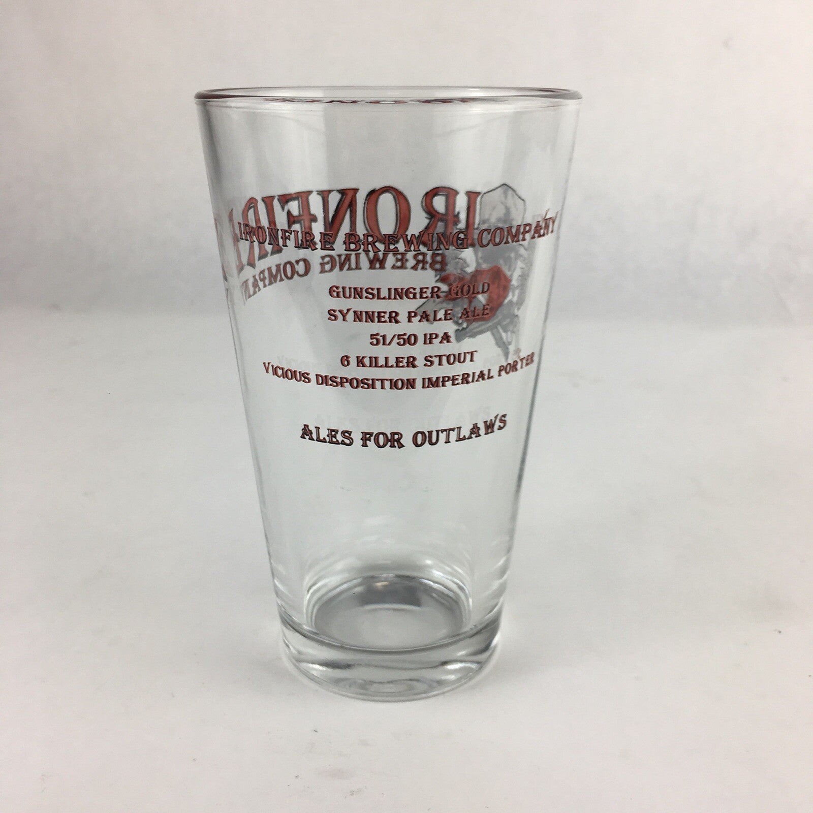 Iron Fire Brewing clear pint beer glass with brewery logo.