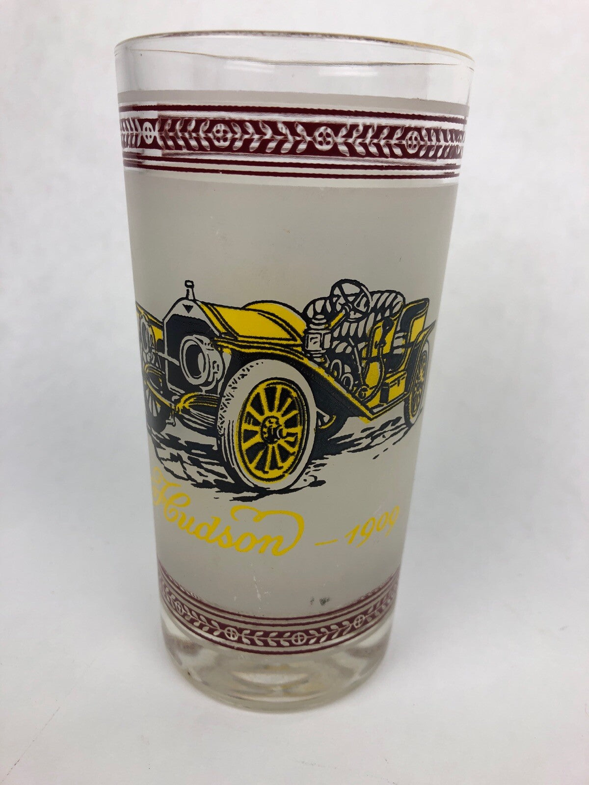 Vintage frosted cocktail glass featuring 1909 Hudson and 1914 Dodge with gold rim.