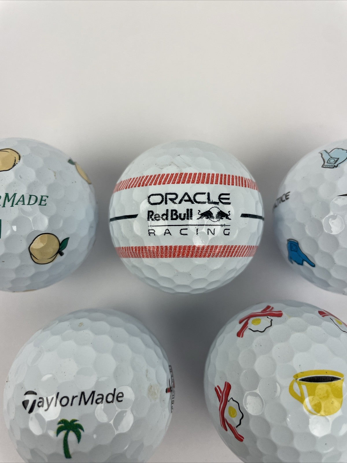 7 TaylorMade TP5x golf balls Oracle Red Bull Shaka Peach Bacon Eggs Palm Shark