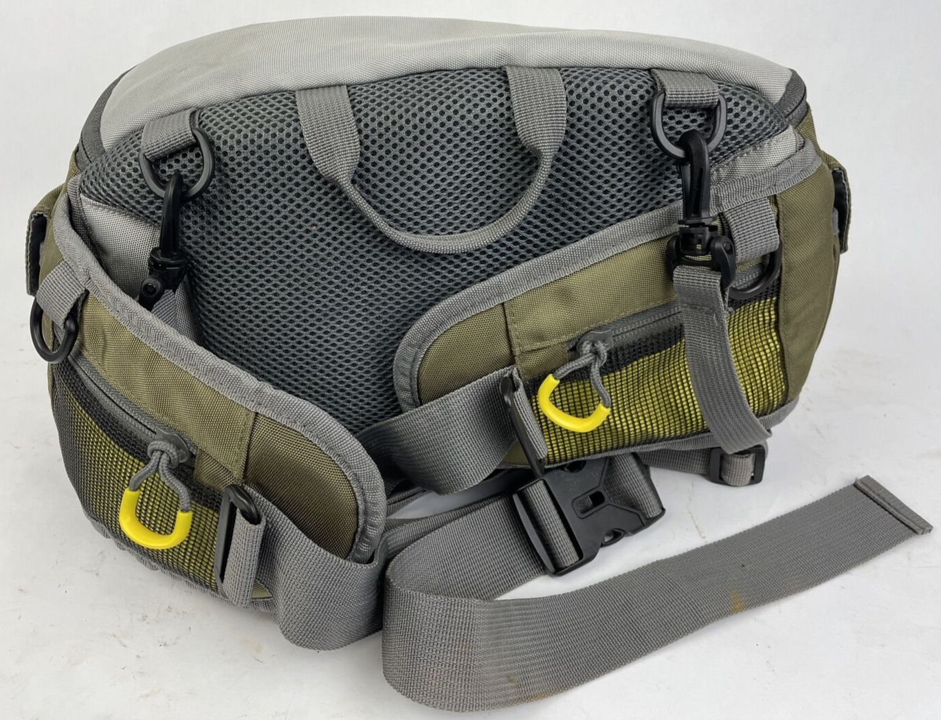 Cabela's Advanced Anglers green waist pack with extras for fly fishing and hiking.