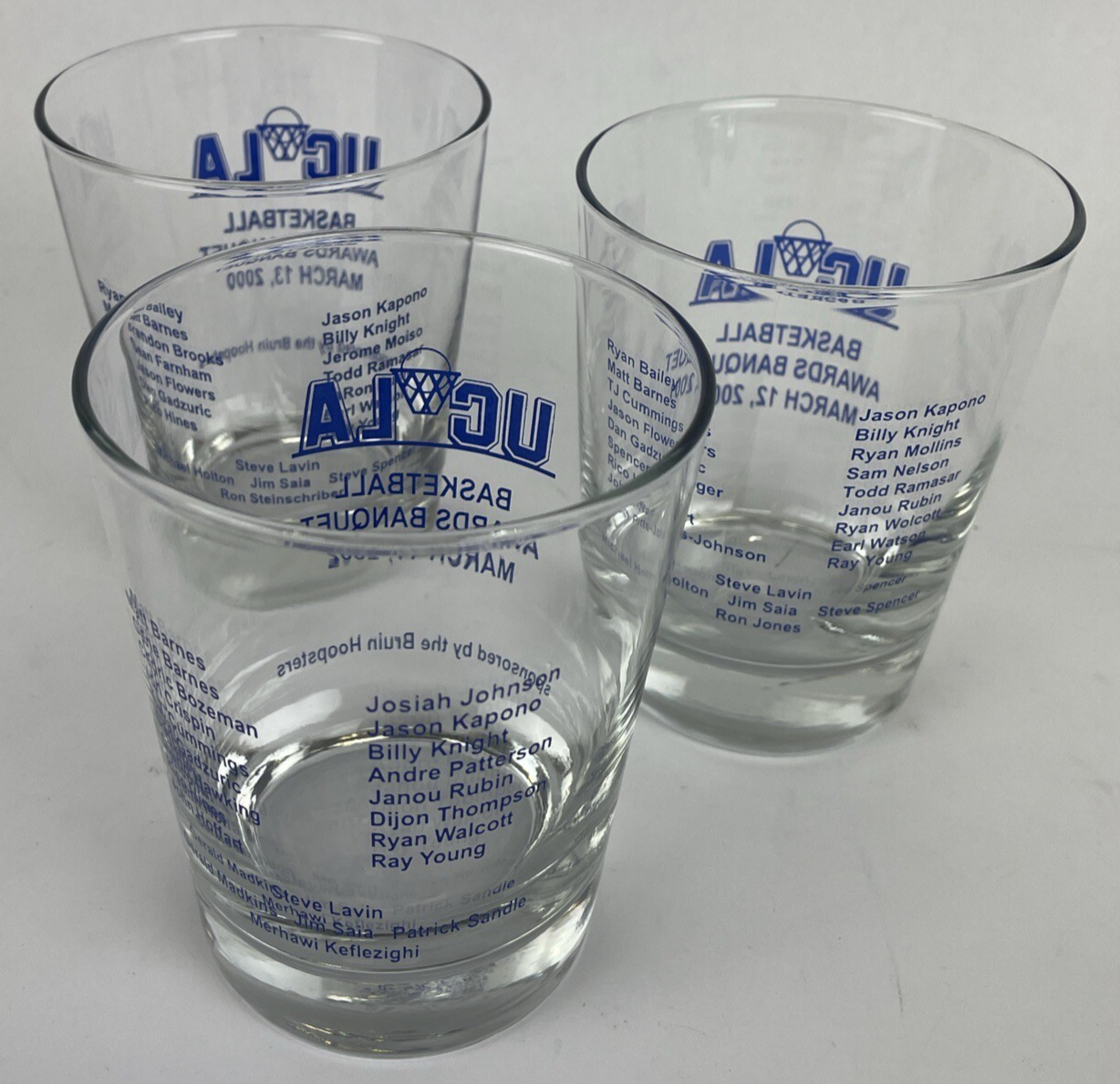 Set of three UCLA Bruins Basketball Awards Banquet highball glasses from 2000, 2001, and 2002.