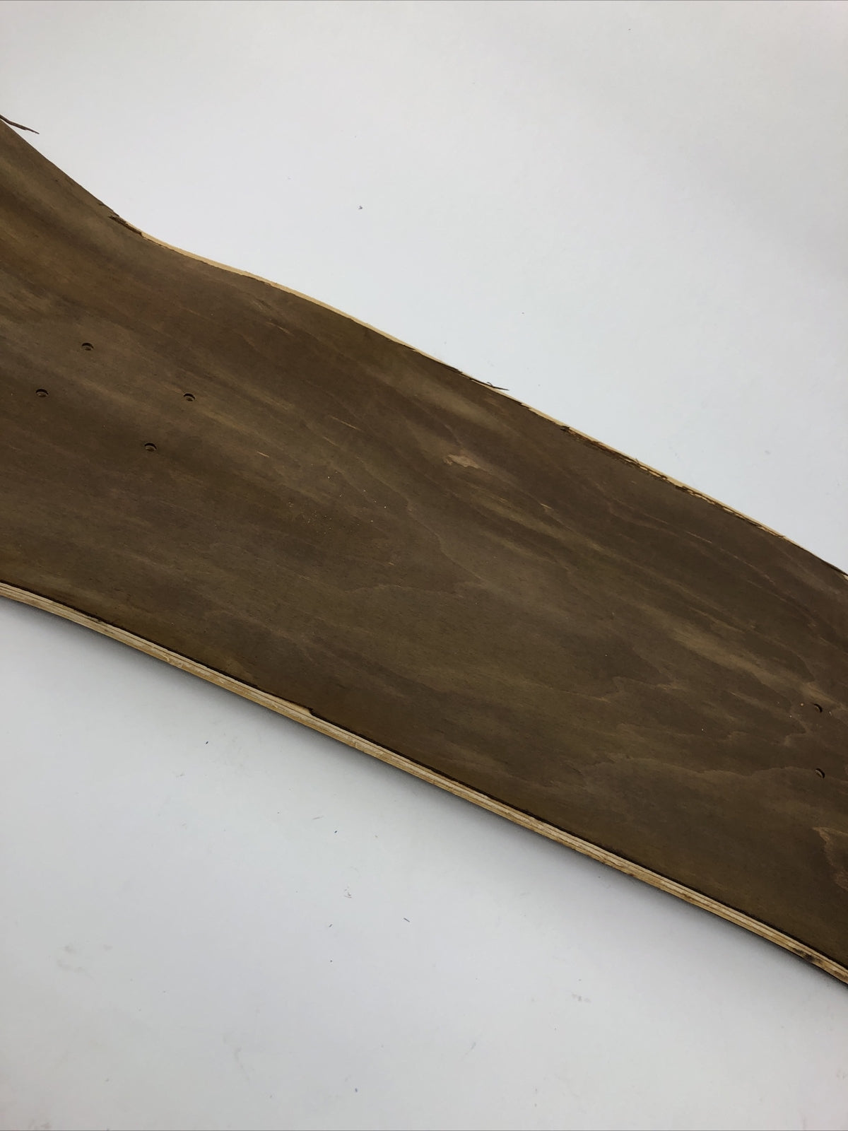 Blank uncut brown stain skateboard deck 10 x 34 inches with 14.25-inch pre-drilled wheelbase.