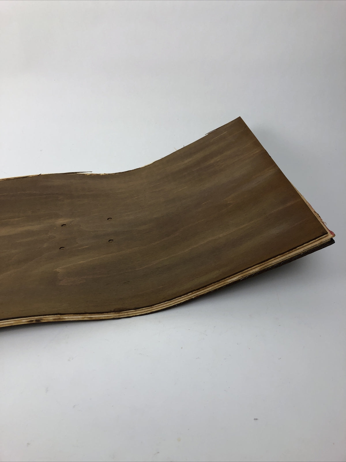 Blank uncut brown stain skateboard deck 10 x 34 inches with 14.25-inch pre-drilled wheelbase.