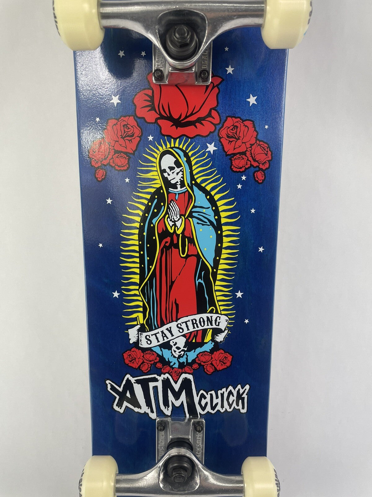 ATM Click Stay Strong 8-inch complete skateboard with Black Smith trucks and 52mm wheels.