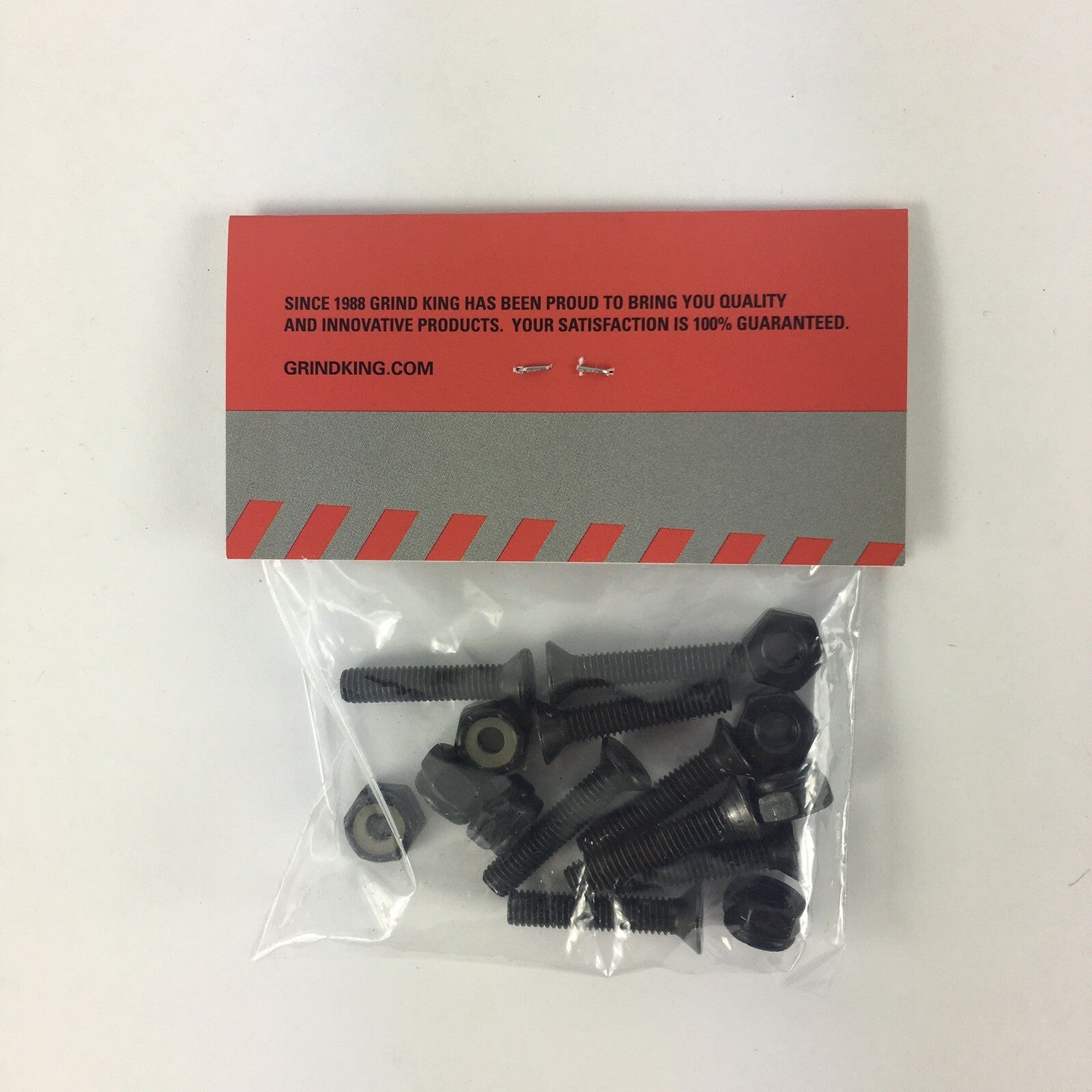 Grind King 7/8-inch black Phillips skateboard hardware set with mounting bolts and lock nuts.