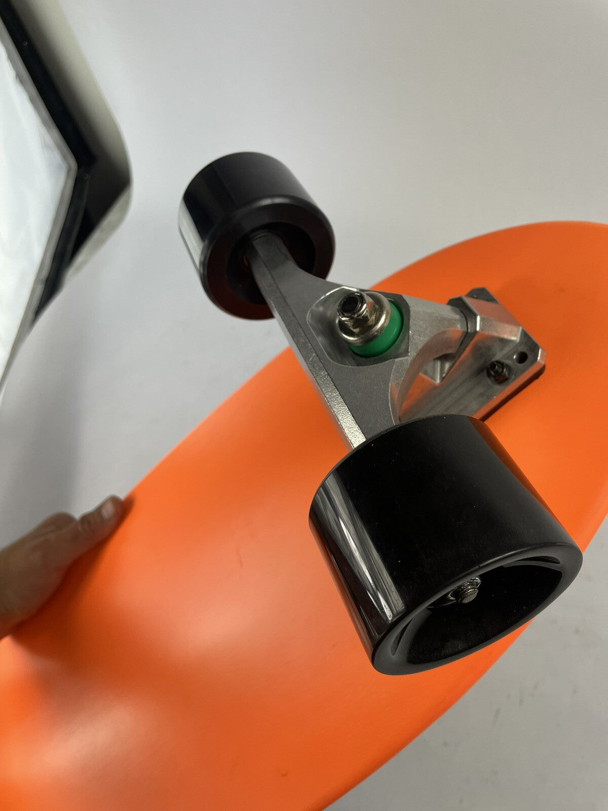 Orange Surf Fish Blank 10-inch complete skateboard with reverse kingpin trucks, 70mm wheels, and ABEC-7 bearings.