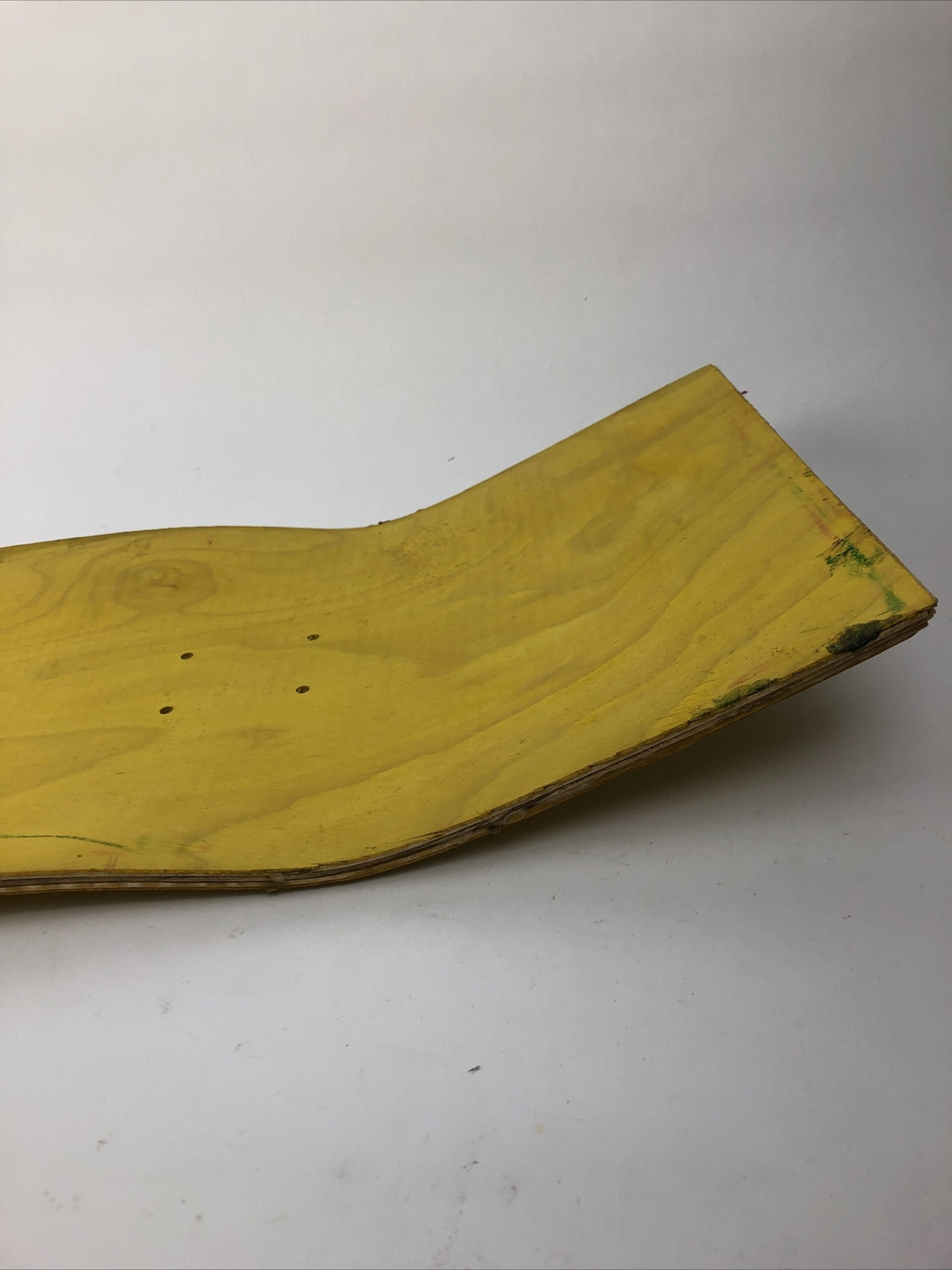 Blank uncut 10 x 34-inch yellow stain skateboard deck with 14.25-inch wheelbase.